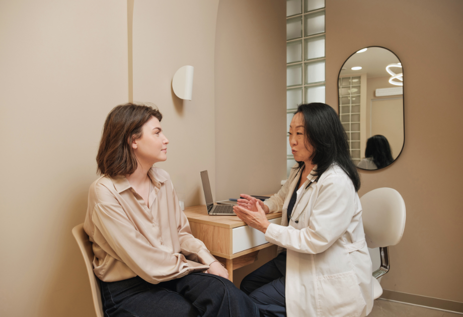 doctor talking to patient while sitting down
